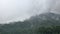 Panorama of mountains with cumulonimbus clouds and the temple in the valley, Bali, Indonesia