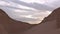 Panorama of mountains in the desert. Sand hills. Drought. Erosion and geology. Changing of the climate. Sunset, sunrise