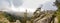 Panorama of mountains rocks forest dry tree. Gorge landscape on a dramatically cloudy day.Lago Naki Plateau