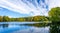 Panorama of multi coloured trees and shrubs in golden autumn colours in Stourhead, Wiltshire, UK