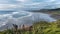 Panorama of Muriwai beach under stormy sky