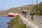 Panorama of Mykonos port and cyclists, Greece