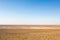 Panorama of the Namak Salt lake, seen from above, with a road visible in the foreground, in the afternoon, in Maranjab desert