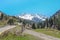 Panorama of nature green mountains, snow and sky in Chimbulak Almaty, Kazakhstan