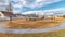 Panorama Neighborhood landscape with recreational park and homes under blue cloudy sky