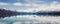 Panorama of New Zealand snow mountain reflect on turquoise lake