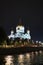 Panorama of the night city with neon lights. Cathedral of Christ the Savior at night