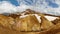 Panorama ocher mountain range with snow remains