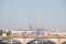 Panorama of the Old Town of Prague, Czech Republic, with a focus on Palackevo Most bridge with a tram passing by and Prague Castle