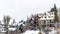 Panorama Overcast sky over colorful homes on hill terrain with fresh white snow in winter