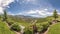 Panorama Panorama of the backyard of home with landscaped grassy lawn and lush plants