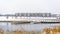 Panorama Panorama of a lake in Daybreak Utah with wooden decks and snowy shore in winter