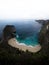 Panorama of Pantai Kelingking Beach blue turquoise tropical ocean limestone cliff Nusa Penida Island Bali Indonesia