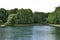 Panorama of the park with ducks. Sunny day in the city park.