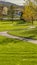 Panorama Pathway winding through a terrain with rich green grasses and young trees