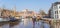 Panorama of people skating on the ice in the Noorderhaven canal