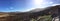 Panorama photograph of Wicklow mountains in Ireland with a beautiful sun