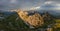 Panorama picture of Mangart Pass and road with illuminated mountains, Julian Alps, Triglav national park, Slovenia, Europe