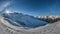 Panorama picture of the Montafon skiing area in Austria with blue sky at daytime