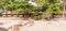 Panorama picture of straw bamboo cottages food shop at Kalim beach