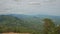 Panorama of Picturesque Valley among Green Hills