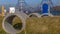 Panorama Playground with tunnels made of concrete pipes on the grassy mounds