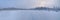 Panorama of polar night in frozen tundra with snow-covered forest on the horizon