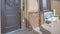 Panorama Porch and front door with wreath and sidelights viewed on a sunny day