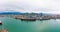 Panorama of the port of Batumi and ships at the mooring wall. Bulk cargo ship under port crane, Batumi seaport, Georgia