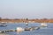 Panorama of the port of Kovin, on the Danube, with boats and ship anchored in frozen waters in winter.