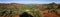 Panorama from the prony wind turbine viewpoint on the mountains and red soil of the South of Grande Terre, New Caledonia