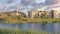 Panorama Puffy clouds at sunset Oquirrh Lake at the front of residential complex buildings at Da