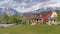 Panorama Puffy clouds at sunset Panoramic view of a large field at the front of residential hous