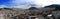 Panorama of quito showing the second largest statue of South America at the background with a blue sky