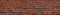 Panorama red brick wall orange masonry uneven wide