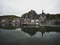 Panorama reflection of Dinant citadel old town historic village with boat in Meuse river Ardennes Namur Wallonia Belgium