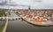 Panorama of Regensburg city in Bavaria with the river Danube the cathedral and the stone bridge in summer with cloudy sky, Germany