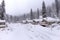 panorama of resort cabins under a layer of snow