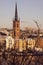 Panorama with Riddarholm Church and colorful houses around on sunny winter day, view from the hilltop.