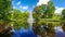 Panorama of the Riga Canal against the background of beautiful Kronvalda Park