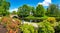 Panorama of the Riga canal against the background of blooming rhododendrons