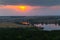 Panorama of the river, fields and forests on the background of a sunset