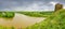 Panorama of river with remains of medieval Zhvanets castle, Ukraine