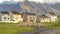 Panorama Road that leads to lovely multi storey homes with mountain in the background