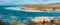Panorama. Rocky cliffs, beach, hills, and California native forest, amazing view from Montana de Oro Bluff trail, CA