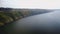 Panorama of rocky hills and winding river on sunny weather.