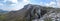 Panorama of rocky mountain ridge and forest covered slope at spring. Crimean mountains