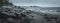 Panorama of a rocky shore. Overcast day. Background for travel materials
