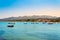 Panorama of Roda tourist town on Corfu island, Greece. Picturesque fishing village on seashore with colorful houses