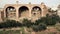 Panorama of the Rome, Italy city view with its ruins, columns, palaces and an impressive Arch of Titus and Colosseum.